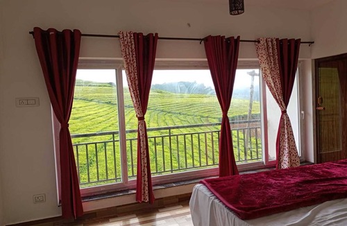 West Mere House | Spacious and serene space with Tea Estate view from every room.n