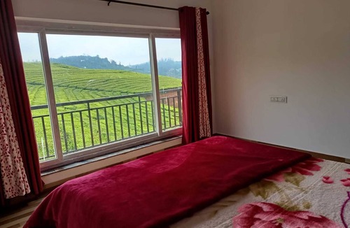 West Mere House | Spacious and serene space with Tea Estate view from every room.n