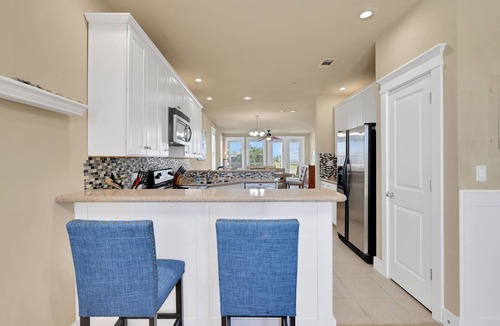 Red Fish Cove House | Spacious beach condo with ocean view, balcony, shared pool & close to the beach