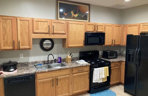 Braselton Apartment | Spacious bedroom with closet, tv and full bed, along with apartment amenities.