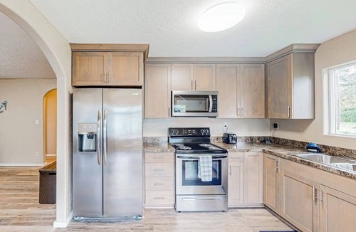 Coos Bay House | Spacious coastal property with separate living quarters, wood stove, & grill