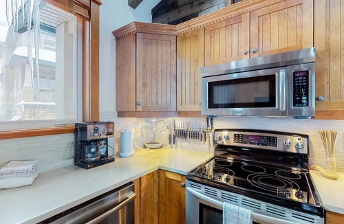 Big White Ski Resort House | Spacious condo with private hot tub, ski in/out access and mountain views