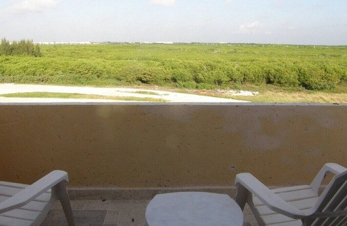 Puerto Juarez Condo | Spacious condo across the road from the beach.