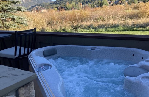 Big Sky Meadow Village Condo | Spacious Condo on Golf Course & Creek w/hot tub
