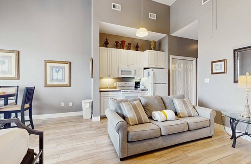 Gulf Place Apartment | Spacious condo with large living area, private balcony & shared pool