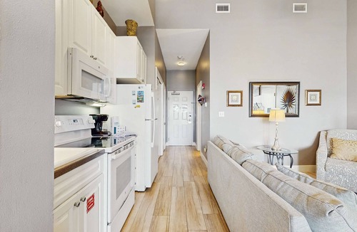 Gulf Place Apartment | Spacious condo with large living area, private balcony & shared pool