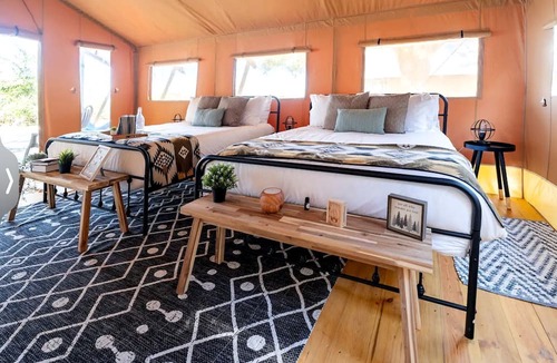 Braden River RV Rental | Spacious Double Safari Tent with Private Fire Pit Near Anna Maria Island in Bradenton, Florida