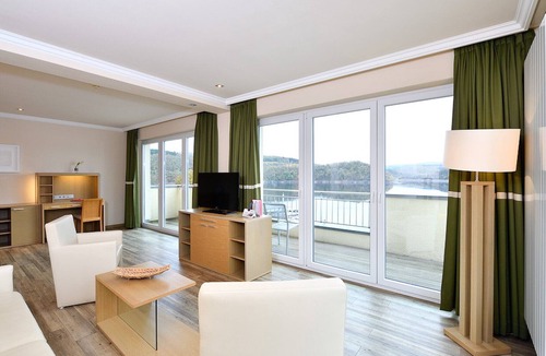 Heimbach Apartment | Spacious double suite with balcony and lake view