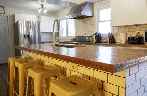 Davenport House | Spacious family home with luxe beds, fenced in back yard, heart of town!