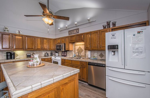 Prosperity House | Spacious grounds and home with large deck and dock in quiet cove.