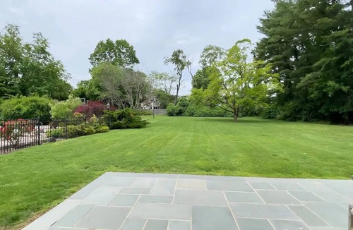 Old Brookville House | Spacious Hampton style house with giant indoor basketball court.