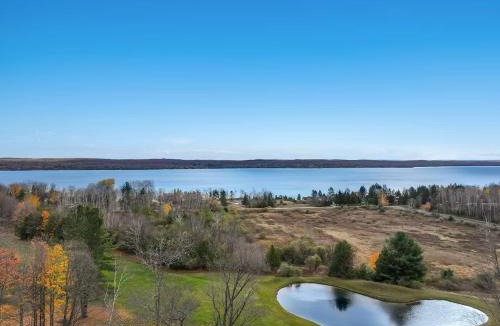 Kewadin House | Spacious Hideaway in Torch Lake and Sunrise Views