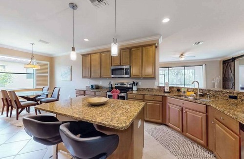 Estero House | Spacious home with enclosed lanai, WiFi, AC, WD, pool, tennis court, & gym