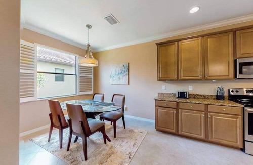 Estero House | Spacious home with enclosed lanai, WiFi, AC, WD, pool, tennis court, & gym