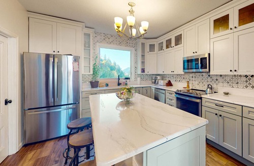 Gardiner House | Spacious home with river views, hot tub, covered porch, deck, grill, & W&D
