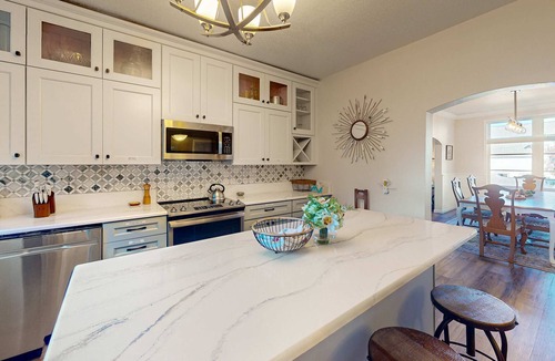 Gardiner House | Spacious home with river views, hot tub, covered porch, deck, grill, & W&D
