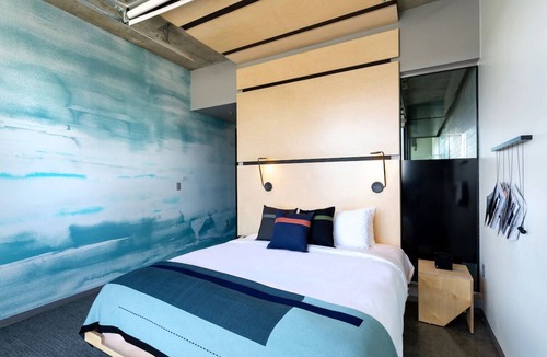 River North Art District Hotel | Spacious Industrial Loft with Stunning Views and Unique Garage Door Feature