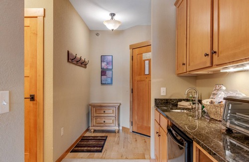 Three Lakes Condo | Spacious lakefront studio with kitchenette, balcony, pool, hot tubs, & firepit