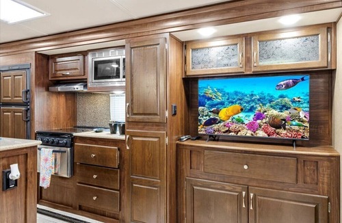 Milton RV Rental | Spacious luxury RV with large kitchen/living room area, private bedroom w/king-size bed, bath and 1/2, with a deck, located in a beautiful RV resort with tons of amenities. Min. stay is 2 nights w/weekly and monthly discounts. Monthly rate is $1,600