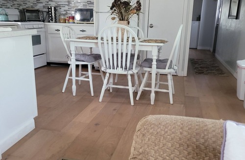 Longmont House | Spacious mobile home with large kitchen/living area and porch with barbeque.