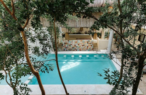 Zama Condo | Spacious modern 3-bedroom condo in Aldea Zama with premium finishes, a lush shared pool, and easy access to restaurants, shops, and Tulum’s beaches.