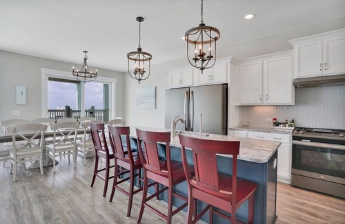 Long Beach Hotel | Spacious oceanfront 7-bedroom home on Oak Island, perfect for large gatherings.