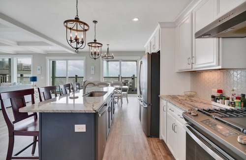Long Beach Hotel | Spacious oceanfront 7-bedroom home on Oak Island, perfect for large gatherings.