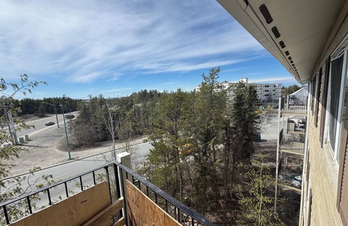 Yellowknife Apartment | Spacious private space with shared washroom and kitchen with young couple.
