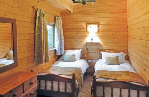 Cullompton Ski Chalet | Spacious timber lodge with one double and one single in one room.