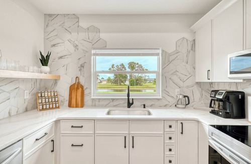 Pebble Beach House | Spacious waterfront 6 Bd duplex in lovely Rotonda West near oceans .