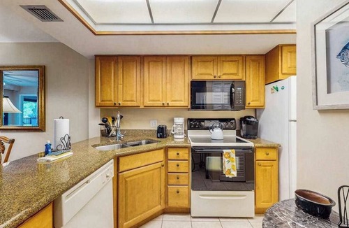 Park Shore Condo | Spacious, waterfront condo with outdoor pool, tennis, & volleyball