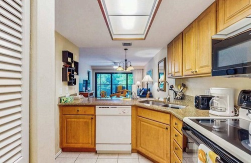 Park Shore Condo | Spacious, waterfront condo with outdoor pool, tennis, & volleyball