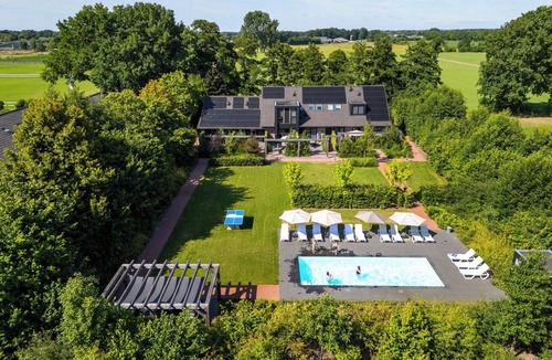Otterlo House | Spacious wellness home for 6 guests with a private sauna and hot tub in the garden. Stylish, single-floor layout and designed for pure relaxation.