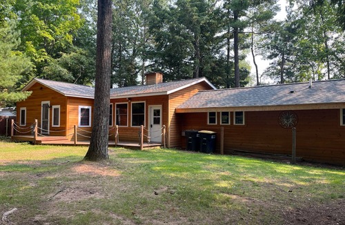 Three Lakes House | Splendid lakefront home with deck, private W/D, fireplace, and patio area