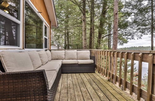 Three Lakes House | Splendid lakefront home with deck, private W/D, fireplace, and patio area