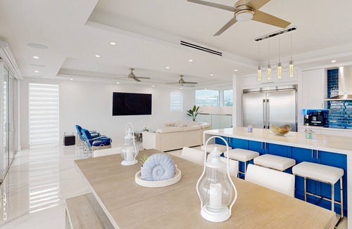 Sexton Cove Estates House | Sprawling waterfront home with pool, outdoor kitchen, game table, grill, & W/D