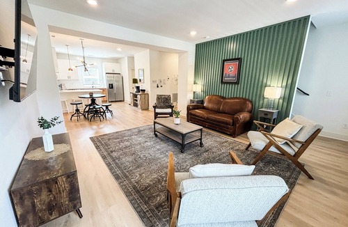Donelson House | Stay steps from the Airport & Broadway in this spacious 3-bed, 3.5-bath townhome that sleeps up to 10. Enjoy a private garage game room, fast Wi-Fi and free parking in a safe Nashville neighborhood. 3 queen bedrooms on separate levels for privacy