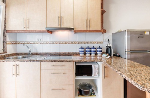 Merexo Apartment | Step into a practically equipped vacation apartment, close to picturesque stretches of coastline and