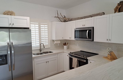Bailey Town Apartment | Steps from beach and infinity pool, Golf Cart Optional