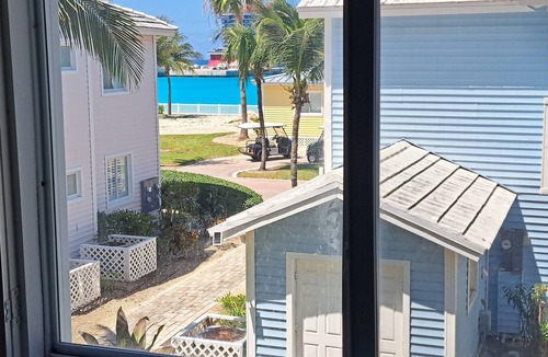 Bailey Town Apartment | Steps from beach and infinity pool, Golf Cart Optional
