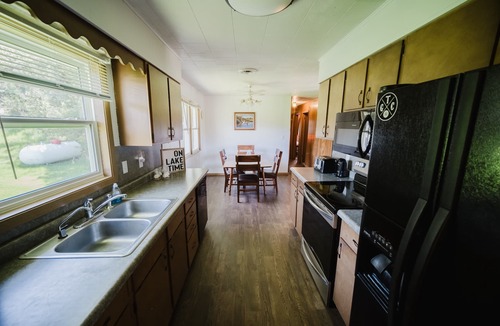 Chamberlain House | Steps from the water, firepit, large yard, family friendly