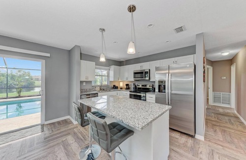 Oakland Hills House | Stocked Pool Home Canal View 8 Miles Beaches, Golfing, Fishing, Entertainment!