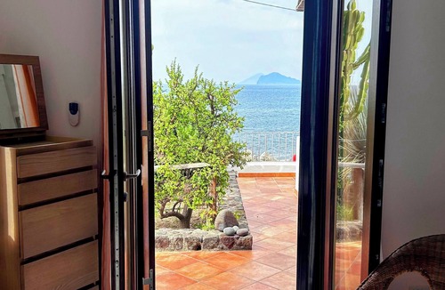 Acquacalda Cottage | Strongyle-Aeolian-style cottage on the beach with beautiful terrace and W-fi