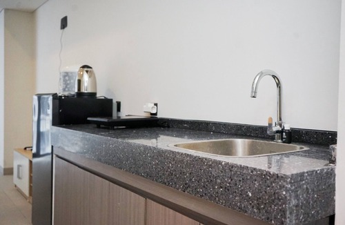 Pagedangan Apartment | Studio Apartment With Sofa At Carstensz Residence