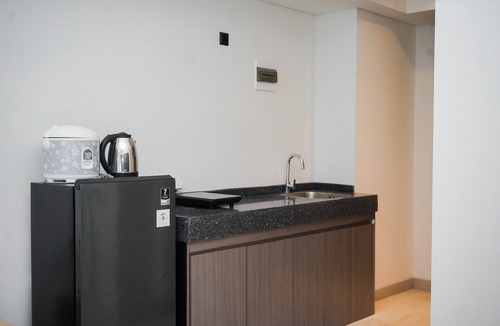 Pagedangan Apartment | Studio Apartment With Sofa At Carstensz Residence