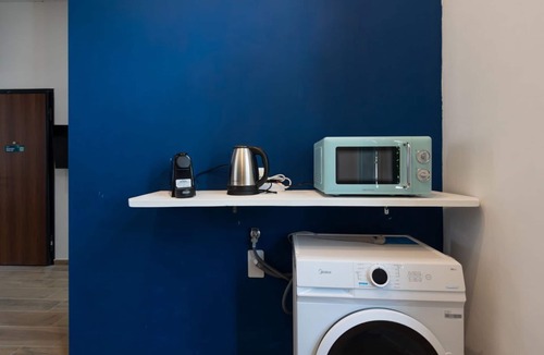 San Donato - Campidoglio Apartment | Studio apartment with double bed, armchair bed and equipped kitchenette.