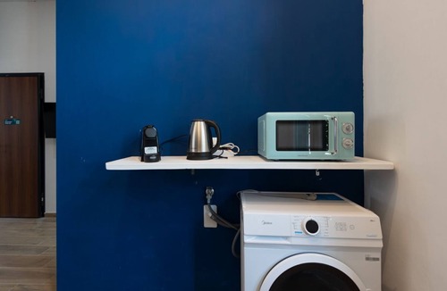 San Donato - Campidoglio Apartment | Studio apartment with double bed, armchair bed and equipped kitchenette.