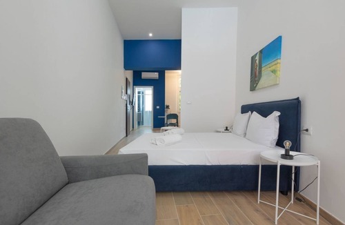San Donato - Campidoglio Apartment | Studio apartment with double bed, armchair bed and equipped kitchenette.