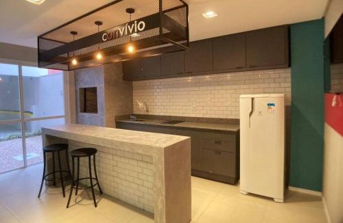 Simoes Lopes Apartment | Studio central completo! Garagem coberta para carros médios Sem elevador