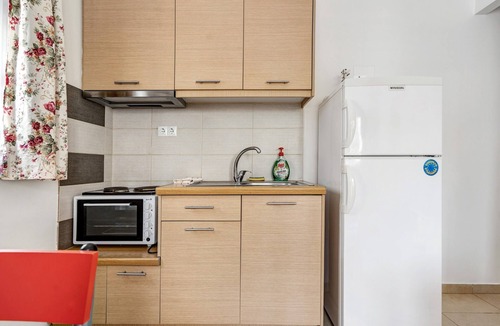 Nidri Apartment | Studio 'Family Junior Suite' with Shared Pool, Wi-Fi and Air Conditioning